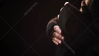 Closeup fit woman wrapping hands with bandage tape preparing for boxing training slow motion