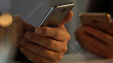 People using smartphones, concept of internet addiction disorder, hands closeup