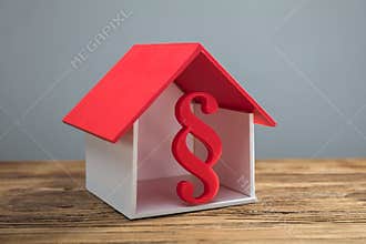 Red Paragraph Sign Inside House Model