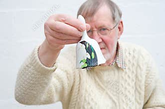 Senior ringing a bell to call for attention.