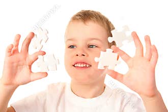 Child with puzzles