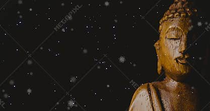 Animation of snow falling over buddha on black background