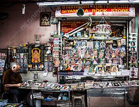 Street Photography of Elderly Man at His Roadside Magazine Shop in Singapore