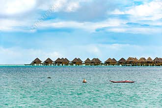 Bora Bora overwater-bungalows  of Bora Bora, luxury resort, hotel, bright green blue lagoon.