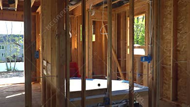 Inside view of wooden under construction new residential apartment beam framing