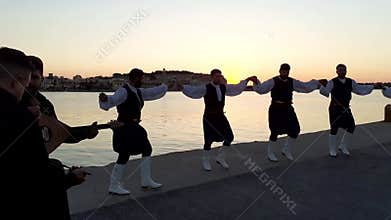 Greek dancers in traditional costume perform folk dance, Rethymno, Crete, Greece