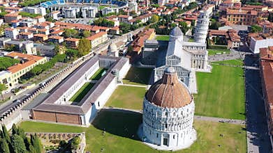 Pisa Cathedral and the Leaning Tower in a sunny day in Pisa, Italy. Pisa Cathedral with Leaning Tower of Pisa on Piazza dei