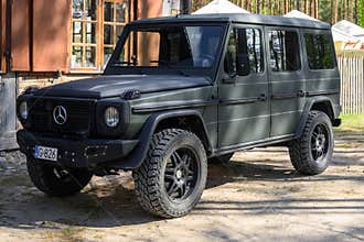 Wdzydze Kiszewskie, Poland - May 15, 2022: Mercedes Benz G-Class parked in front of a house