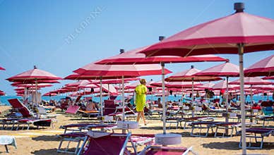 Red beach umbrellas and blue sky
