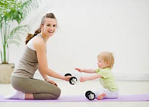Mother and baby spending time in gym
