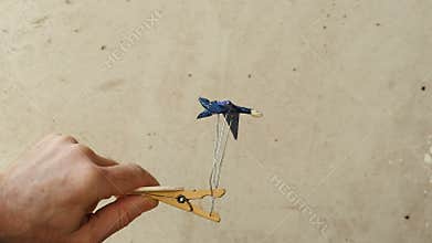 Bird automaton on a clothespin