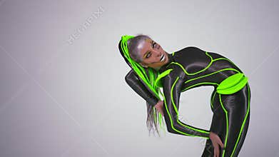 Side view slim woman in futuristic costume dancing robot dance looking at camera lying down at white background