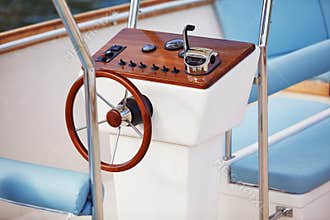 Close-up view of the yacht steering wheel on the sea. Yacht, sea, summer