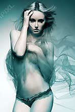 Attractive fashion model with long blond hair.