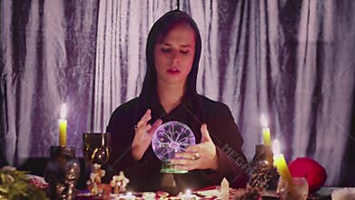 Male fortune teller performing ritual with crystal ball foreseeing future