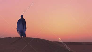 SLOWMOTION. Women wearing beautiful blue and white Arab clothes looking to sunset at the desert