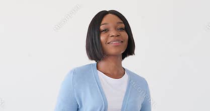 Woman with braces smiling over white background