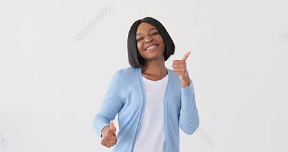 Happy woman giving thumbs up gesture