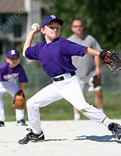 Boy pitching baseball