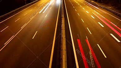 Light trails on the highway from speeding cars