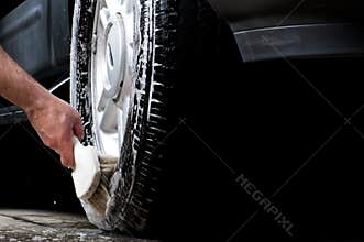 Cleaning tire in a car wash