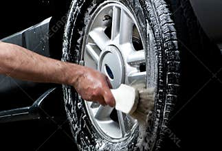 Cleaning tire in a car wash