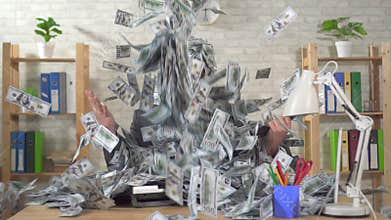 Big pile of money raining down on businessman, slow mo