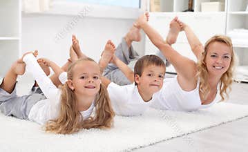 Family doing stretching exercises at home