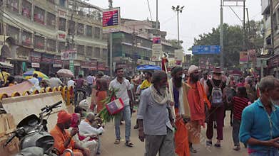 Busy crowded street in Varanasi, India. Steadicam shot