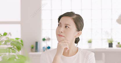 Cute puzzled young woman thinking and choosing
