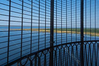 View to the Baltic sea and Sõrve peninsula through the protective grid  and railings from top of the Sõrve lighthouse