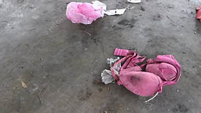 Dirty clothing laying on the floor.