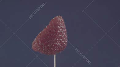 Strawberry rotating with loop on blue screen for chroma key
