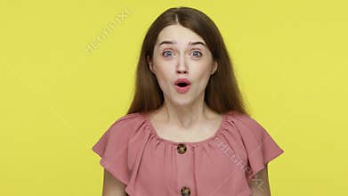 Woman cheering for victory, opening her mouth in amazement.