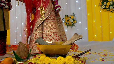 Indian bride and groom taking wedding Phera / rounds around the sacred Hawan fire