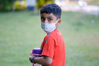 A child wearing mask in casual dress; casual portrait