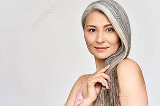 Senior happy middle aged mature asian woman headshot portrait. Hair care advertising.