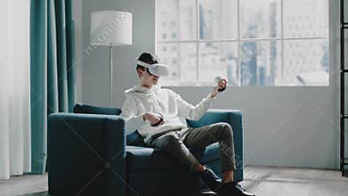 Professional musician in white VR headset plays guitar