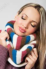 Cute girl in warm comfort scarf
