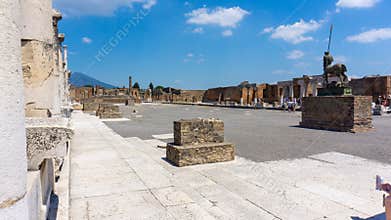 Civil Forum in Pompeii. The blue sky and Mount Vesuvius provide the backdrop. Pompei, Campania, Italy, July 2020.