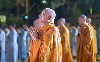 Monks are chanting prayers for peace during annual Amitabha Buddha ceremony