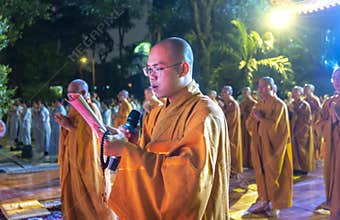 Monks are chanting prayers for peace during annual Amitabha Buddha ceremony