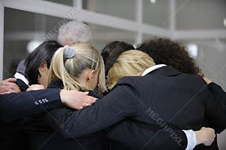Team building event: group hug in office