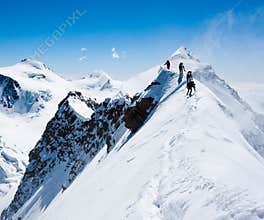 Climbers on a narrow ridge