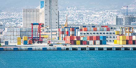 Warehouse and shipping container carriers at cargo port terminal