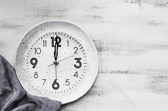 Intermittent Fasting Plate and Napkin on Rustic Table