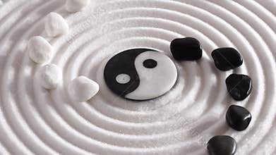 Japanese zen garden with stones in textured sand