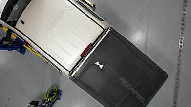 Pickup Truck on an Automotive Lift Inside Auto Service