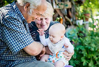 Grandparents and grandson, happy smiling family