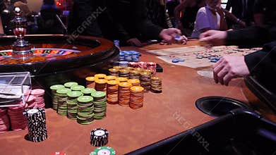 Poker Chips, aces, cards and dice in casino gamble red table.